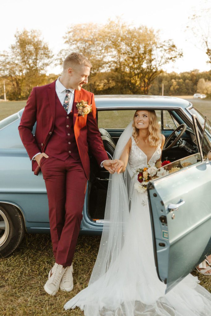 Newly wed couple posing with a vintage car in Mt Home Arkanas